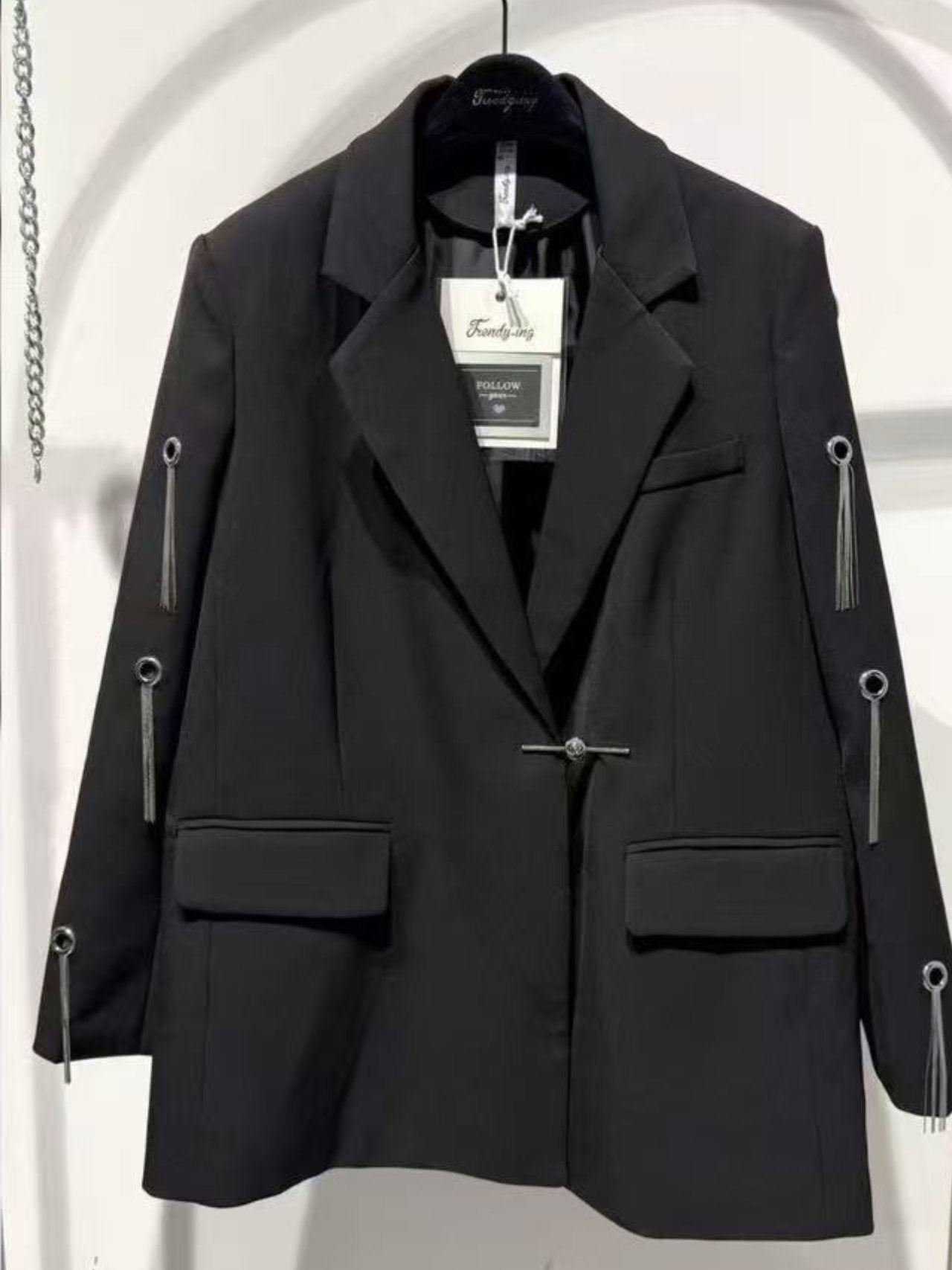 Blazer con borchie ad anelle