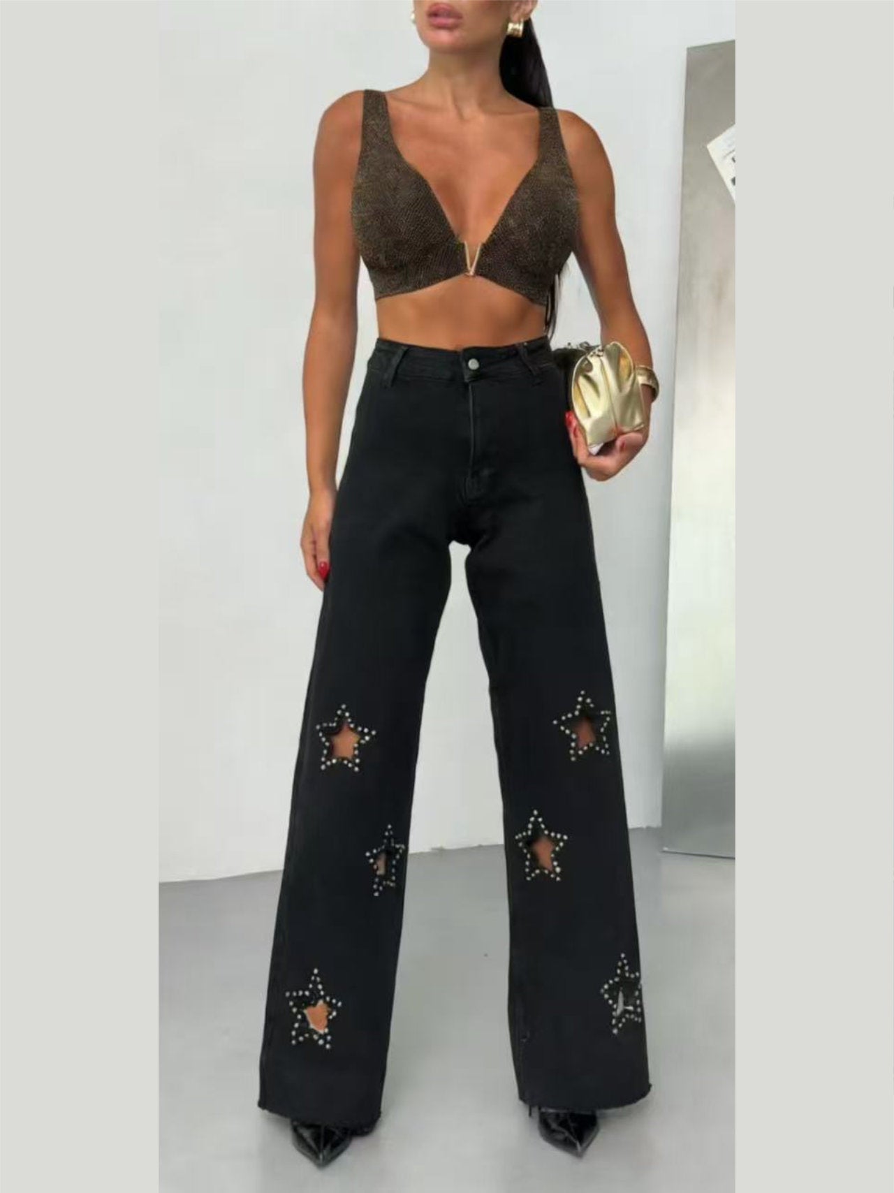 Jeans con fori a stella