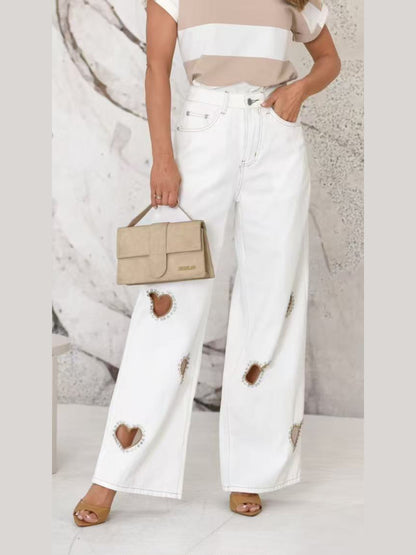 Jeans con fori a cuore