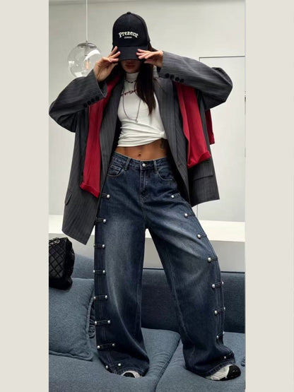 Jeans con borchie laterali