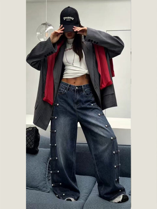 Jeans con borchie laterali