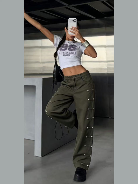 Jeans con borchie laterali